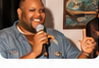 Speaker holding a microphone