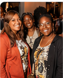 Three attendees smiling at BLAQTOBERFEST